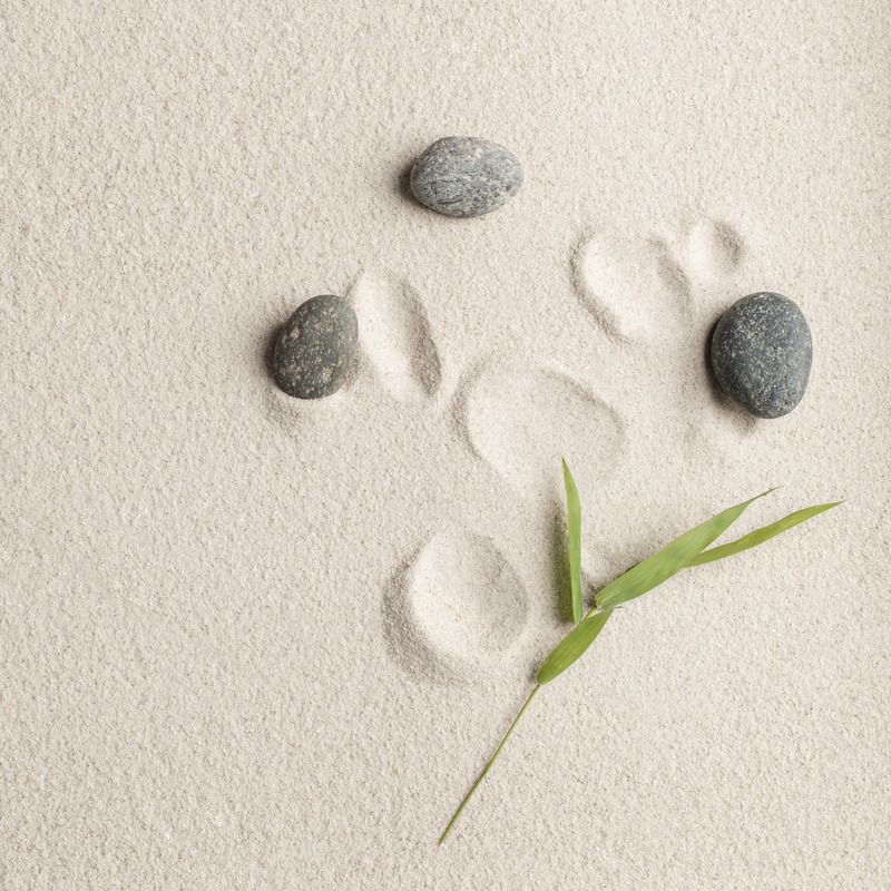 zen-stones-sand-background-health-wellness